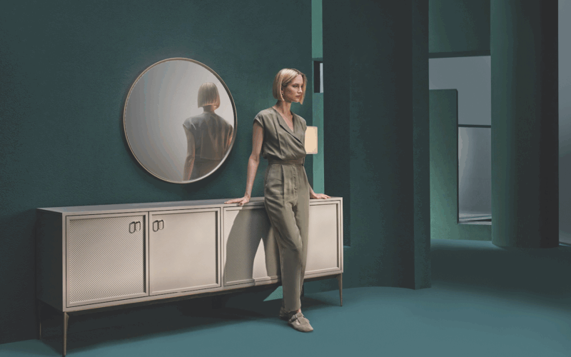 Hera collection console by Enza Home young model stading in front of the hera console in interior design space